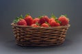 Strawberry basket with a dark background Royalty Free Stock Photo