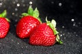 Strawberry on a black background. Brilliant background with berries