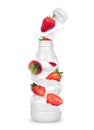 Strawberry with a bottle made from milk splashes