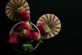 Strawberry bowl cenital photo with dark background