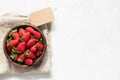 Strawberry in bowl. Fresh strawberries on white concrete background Royalty Free Stock Photo