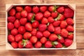 Strawberry box placed on a wooden table Royalty Free Stock Photo