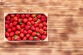 Strawberry box placed on a wooden table Royalty Free Stock Photo