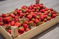 Strawberry box placed on a wooden table, healthy living concept Royalty Free Stock Photo