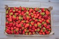 Strawberry box placed on a wooden table, healthy living concept Royalty Free Stock Photo