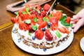 Strawberry cake with blueberries in cream and mint leaves Royalty Free Stock Photo