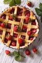 Strawberry cake close up in baking dish, vertical top view Royalty Free Stock Photo