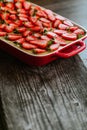 Strawberry cake on the old dark wooden table Royalty Free Stock Photo