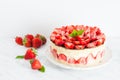 Strawberry cake Fraisier on the white plate and cups Royalty Free Stock Photo