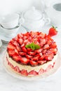 Strawberry cake Fraisier on the white plate and cups Royalty Free Stock Photo