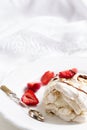 Pavlova - meringue cake with fresh strawberries. meringue roulade with creamstrawberries and raspberries Royalty Free Stock Photo