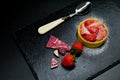 Strawberry cake tart with cream and coconut chips and chocolate