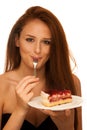 Strawberry cake - wman eats sweet dessert isolated Royalty Free Stock Photo