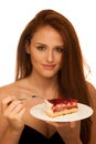 Strawberry cake - wman eats sweet dessert isolated Royalty Free Stock Photo