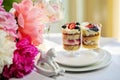 Strawberry cheesecake in glasses with fresh strawberries and cream cheese on wooden background. Healthy homemade dessert Royalty Free Stock Photo