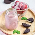 Strawberry cheesecake smoothie with cream cheese and milk, served with chocolate cookies, square format Royalty Free Stock Photo