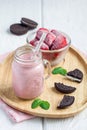 Strawberry cheesecake smoothie with cream cheese and milk, served with chocolate cookies Royalty Free Stock Photo
