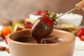 Strawberry in chocolate close up. Chocolate fondue Royalty Free Stock Photo