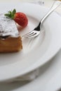 Strawberry and Chocolate dessert with fork; tall macro view