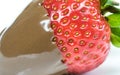 strawberry in chocolate over white background Royalty Free Stock Photo