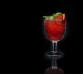 Strawberry cocktail with crushed ice on a black background Royalty Free Stock Photo