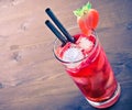 Strawberry cocktail with ice on old wood table, old style Royalty Free Stock Photo