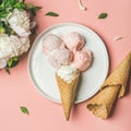 Strawberry and coconut ice cream, cones, white peonies. Square crop Royalty Free Stock Photo