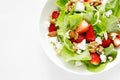 Strawberry and cottage cheese fresh fruit salad with walnut, almond and lettuce, top down view, flat lay Royalty Free Stock Photo