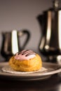 Strawberry cream puff pastry with a silver set of coffee and milk Royalty Free Stock Photo