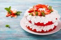 Strawberry and cream sponge cake. Homemade summer dessert on blue wooden table Royalty Free Stock Photo