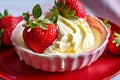 Strawberry with creamy custard, on a red surface Royalty Free Stock Photo