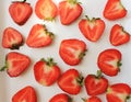 Strawberry creative pattern on white background . Isolated food backdrop. Sliced ripe red berry with green leaves Royalty Free Stock Photo