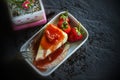 Strawberry crepe cake, topping fruits and pouring strawberry jam on ceramic plate on wood table Royalty Free Stock Photo