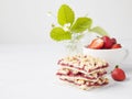 strawberry crumb bars with fresh red berries in a cup and strawberry buch with flowers on grey background Royalty Free Stock Photo