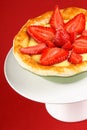 Strawberry and custard tart on a cakestand Royalty Free Stock Photo
