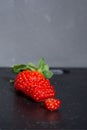 Strawberry cut into slices on a table with a stone background Royalty Free Stock Photo