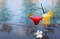 Strawberry daiquiri and pina colada on the pool background. Tropical holidays Royalty Free Stock Photo