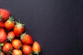 Strawberry on dark background with selective focus and crop fragment Royalty Free Stock Photo