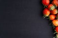 Strawberry on dark background with selective focus and crop fragment Royalty Free Stock Photo