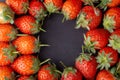 Strawberry on dark background with selective focus and crop fragment Royalty Free Stock Photo