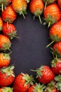 Strawberry on dark background with selective focus and crop fragment Royalty Free Stock Photo