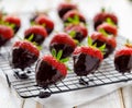 Strawberry dessert, Dark chocolate covered strawberries, fresh strawberries dipped in melted dark chocolate Royalty Free Stock Photo