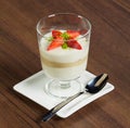 Strawberry dessert in glass on brown table Royalty Free Stock Photo