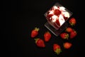 Strawberry dessert with strawberries on a black background, top view.