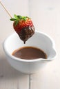 Strawberry dipped in melted chocolate