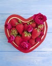 Strawberry dish heart, flower rose design dessert on colored wooden background