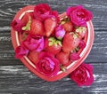 Strawberry dish heart, flower rose summer festive design dessert on colored wooden background Royalty Free Stock Photo