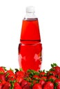 Strawberry drink in the plastic bottle with fresh strawberries Royalty Free Stock Photo