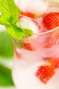 Strawberry drink.Refreshing cocktail. water in glass with ice and strawberries. Mineral water with ice and strawberries Royalty Free Stock Photo