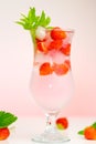 Strawberry drink.Refreshing summer cocktail.Summer drink.mineral water glass with ice and strawberries with leaves on a Royalty Free Stock Photo